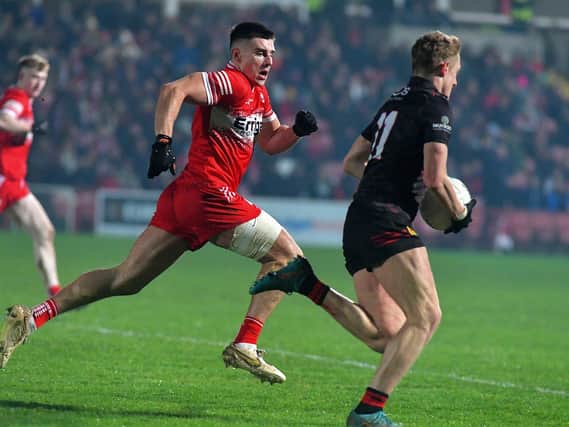 Derry’s Conor Doherty tracks Down’s Liam Kerr. Photo: George Sweeney