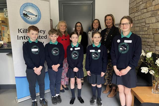 Kilbroney staff past and present, pictured with pupils in the student council.