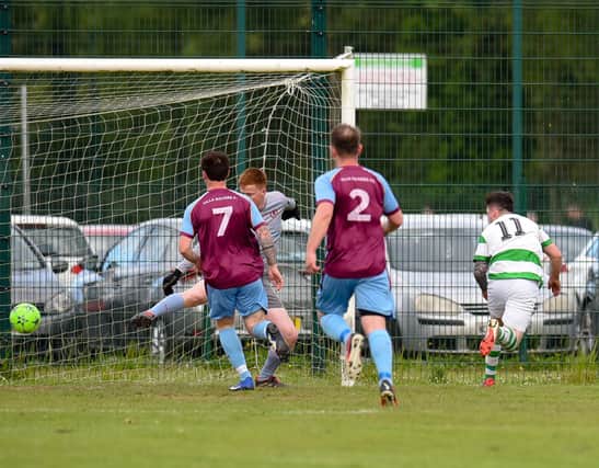 Newry Celtic striker Caolan Gray beats Villa keeper Conor McAteer to score his second goal at Derrylecka. Pictures: Brendan Monaghan