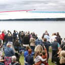 The Red Arrows dazzle spectators with their diamond nine aerobatic display across the shores of Belfast Lough