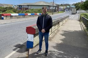 Cllr Michael Rice at the bridge on the Rooney Road.