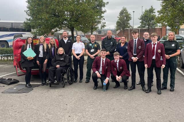 Students with some of those who took part in the Road Safe Roadshow.