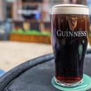 A freshly poured pint of Guinness. Photo by PAUL FAITH/AFP via Getty Images