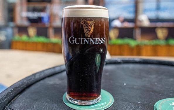 A freshly poured pint of Guinness. Photo by PAUL FAITH/AFP via Getty Images