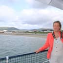 Newry, Mourne and Down District Council Deputy Chairperson, Councillor Geraldine Kearns with Captain Ivor Campbell onboard the Carlingford Lough Ferry.