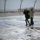 Walkers battle stormy weather.