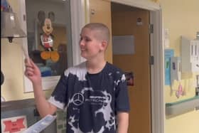 Daniel Greer rings the bell at Manchester Children's Hospital to signify the end of his cancer treatment.