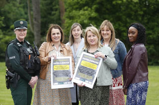 Representatives from local statutory agencies and the Lisburn YMCA launch a free information session for parents/guardians on the impact of young people smoking vapes, the event takes place on Thursday 6 June 2024 at 7pm in the St Patrick’s Centre, Downpatrick. Included in the photo are (L-R) Sergeant Suzanne Cochrane, Downpatrick Neighbourhood Policing Team; Jacqueline Urey, Policing & Community Safety Partnership; Pauline McMullan, Lisburn YMCA; Councillor Oonagh Hanlon, Chairperson of PCSP, Katrina Hynds and Taucher McDonald, DEA Co-Ordinators.