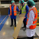 Minister Kimmins is pictured with Ciaran Rodgers and Kevin Kane during a visit to Saica Pack, Warrenpoint.