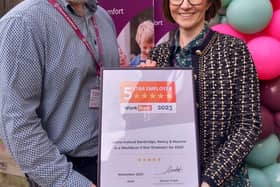 Owners Declan O’Duil and Una O’Duil, standing proudly with their WorkBuzz certificate.