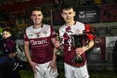 Joint captains Colm Maginn and county final Man of the Match Pearse McPolin.