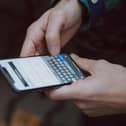A person holding a mobile phone. Picture: Unsplash.