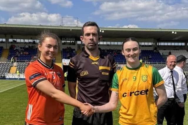 Armagh captain Clodagh McCambridge and Donegal captain Roisin Rodgers pictured with referee Gavin Finnegan ahead of the Ulster Final.