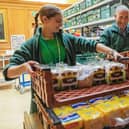 Volunteers pack emergency food parcels