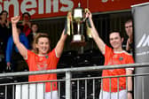 Armagh's Kelly Mallon and Sarah Marley hoist the Ulster SFC title after their win in 2021. Pics: Brendan Monaghan