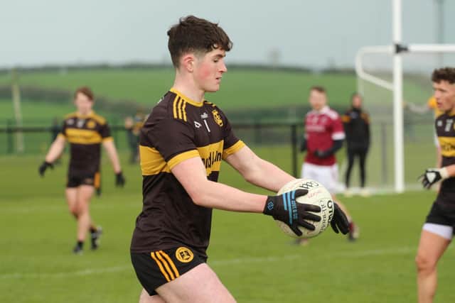 Oran Byrne holding possession during the Glenn v Slaughtneil game.