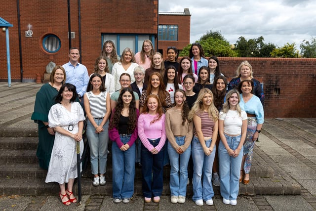 Some of the top performing A Level students at Our Lady’s Grammar School: Eva Cassidy, Rhia Cunningham, Deirbhile Devlin, Bronagh Dorrian, Katie Farrell, Eliza-Mae Garvey, Niamh Haughey, Abbie Keenan, Ellen McAlinden, Katie McEntee, Ella McEvoy, Ellen McGoran, Molly McGouran, Rebecca McMahon, Meabh McPolin, Niamh McSherry, Erin Rice, Madelaine Rogan, Niamh Sherry, Keela Smyth, Olivia White and Aissatu Zabonaite Jalo Rombao.are pictured with Principal, Mrs Fiona McAlinden, Vice-Principals Mr Thomas Hackett, Ms Katrina Murphy, Head of Sixth Form Mrs Sinead McLaughlin and Year Head Mrs Catherine Rohrs. INNR3300