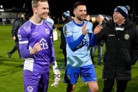 Warrenpoint keeper Daniel Devine and Jim O'Hanlon celebrate their 1-0 victory over Rathfriland Rangers on Tuesday night that all but guarantees the Milltown side the Premier Intermediate League title.