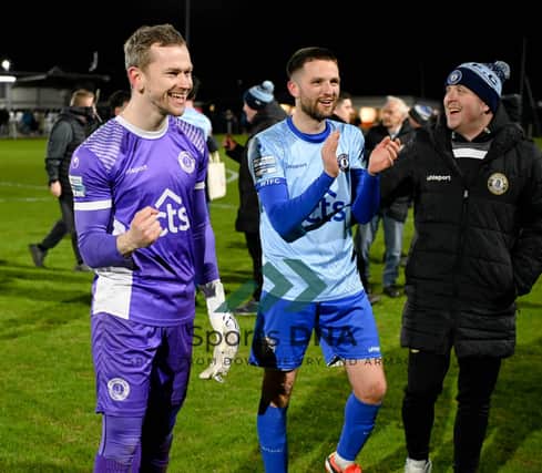 Warrenpoint keeper Daniel Devine and Jim O'Hanlon celebrate their 1-0 victory over Rathfriland Rangers on Tuesday night that all but guarantees the Milltown side the Premier Intermediate League title.