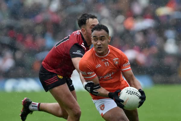 Armagh's Jemar Hall breaks clear of Down's Ryan Johnston.