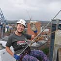 Kerri Rafferty, ophthalmic director at Specsavers Newry scales The Europa Hotel in support of Simon Community.