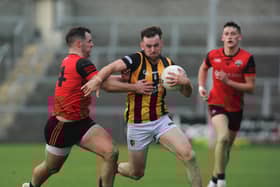 Crossmaglen's Callum Cumiskey goes past Madden's Ryan Morgan during the 2023 Armagh SFC Semi-final.