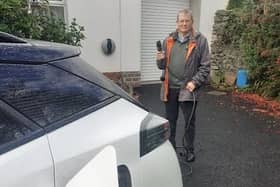 Cllr Cadogan Enright charging his electric vehicle.