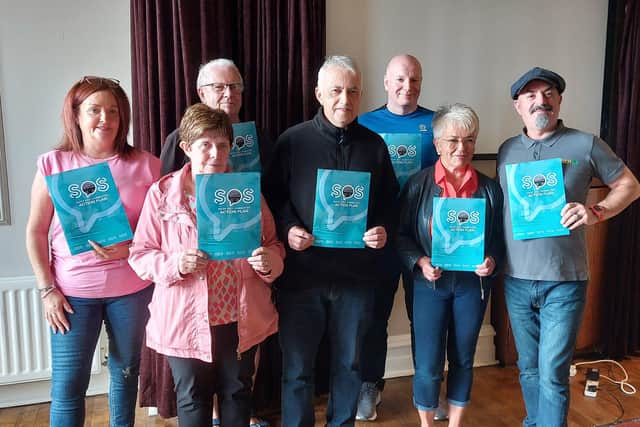 Members of the SOS Daisy Hill Committee launch their action plan at the Bank Bar on Monday evening.