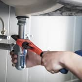 Plumber fixing a sink.
