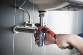 Plumber fixing a sink.
