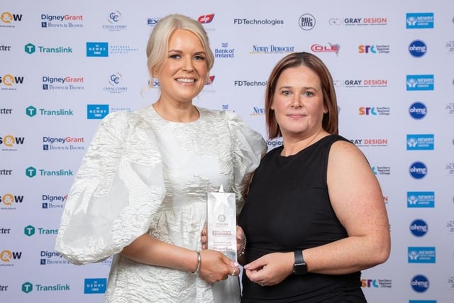 Diane Burke (right), Regional Director of National World, owners of the Newry Reporter, presents the Best Professional Services Employee to Sarah McStravick, Digney Grant.