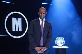 Host  Clive Myrie with Mastermind trophy