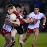 Down U20 forward Barra McEvoy avoids a tackle from Tyrone's Matthew Quinn in Burren earlier in their Ulster campaign. Pic: Brendan Monaghan