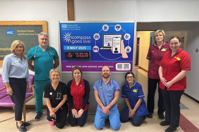 Staff pictured with the countdown clock in Daisy Hill Hospital.