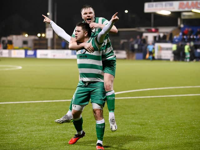 Neil Barr and Jack O'Doherty celebrate Barr's decisive second half goal against Lincoln Courts during Cleary Celtic's 2-0 Junior Cup semi-final victory at Stangmore Park.