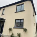 Outside view of a house printed using 3D concrete technology.