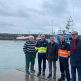DAERA Minister Andrew Muir is pictured on a visit to Ardglass harbour with Dick James from the Ardglass Harbour Development Group, Kevin Quigley, CEO of the Northern Ireland Fishery Harbour Authority, Ardglass Harbour Master James Lenaghan and Comgall Milligan, Chair of the Ardglass Harbour Development Group.