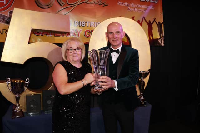 Hugh Morgan presented on behalf of the Morgan Family their Trophy in memory of their sister Bridget to Ann Quinn who has given exceptional service to Gateway Club. INNR4852:.