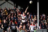 Pat Havern flicks on a high ball during Down's defeat to Louth earlier in the league. Picture: Brendan Monaghan BM14.jpg