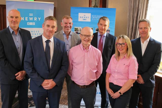 Seamus McCann, Head of Emergency Response and James Kelly, Head of Operations DfI Rivers, Eamonn Connolly, Newry BID Manager, Peter Murray, Chair of Newry BID, Jonathan McKee, Director Rivers Development, Selena Fairburn, Business Owner, Newry and Gary Quinn, Director Rivers Operations. (Photo credit: Lianne McCooey)