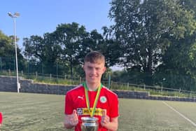 Alex Heaney with Cliftonville U18s All-Ireland Cup Winners Cup they won last week.