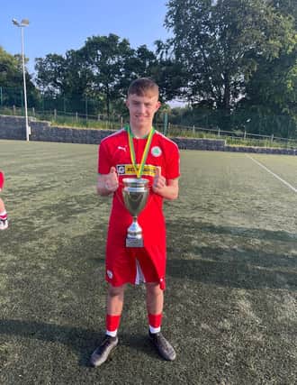 Alex Heaney with Cliftonville U18s All-Ireland Cup Winners Cup they won last week.