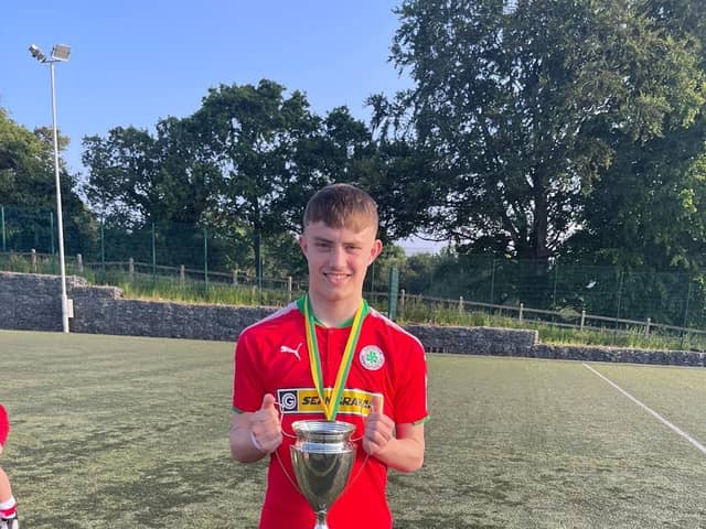 Alex Heaney with Cliftonville U18s All-Ireland Cup Winners Cup they won last week.