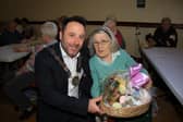 Alice won the third Easter Hamper at the free raffle and Chairperson Pete Byrne presented it to her.