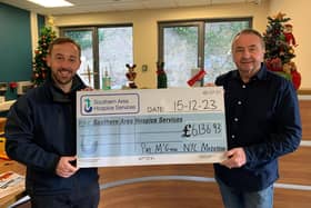 Pat McGinn (right) presents the cheque to James McCaffrey, Southern Area Hospice!