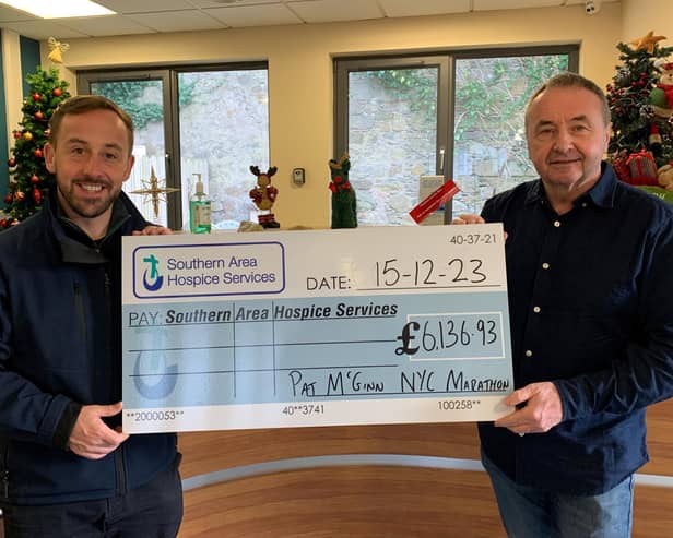 Pat McGinn (right) presents the cheque to James McCaffrey, Southern Area Hospice!