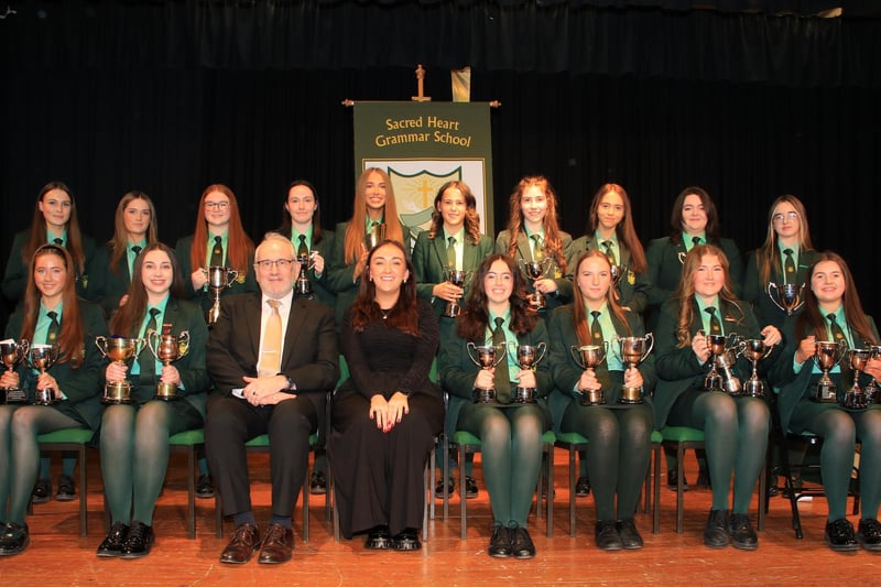 Principal Shane Comer, Anne Marie Mulholland past pupil and guest speaker with Trophy Winners at Sacred Heart Grammar School GCSE Prizegiving. INNR4703