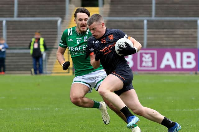 Armagh's Aidan Nugent takes on Fermanagh's Fionan O'Brien.