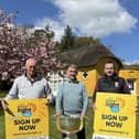 Declan Murphy (Camlough Community Association), Seamus McCabe (CEO, PIPS Hope & Support), Eamonn McCann (Craobh Rua Camlocha Hurling Club) pictured at Derramore House with the Sam Maguire.