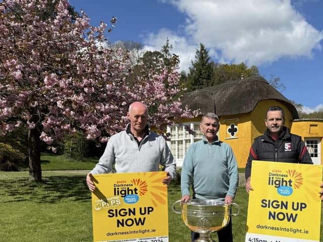 Declan Murphy (Camlough Community Association), Seamus McCabe (CEO, PIPS Hope & Support), Eamonn McCann (Craobh Rua Camlocha Hurling Club) pictured at Derramore House with the Sam Maguire.